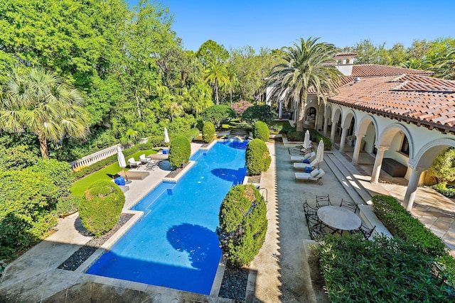 pool featuring a patio and fence