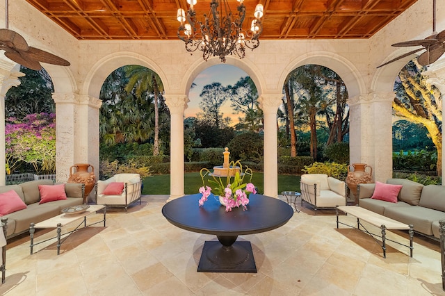 patio terrace at dusk featuring an outdoor living space