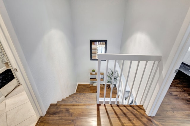 stairway with wood finished floors