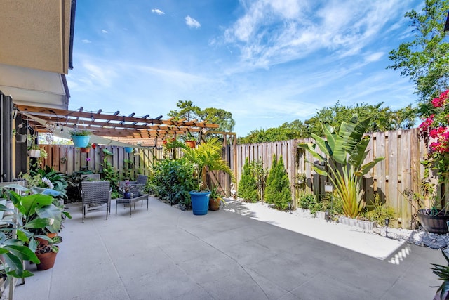 view of patio featuring a fenced backyard and a pergola