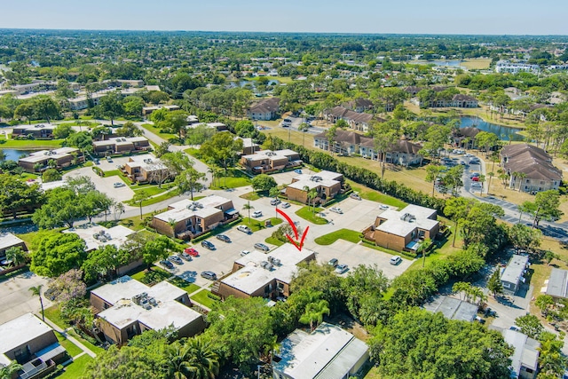 bird's eye view with a water view and a residential view