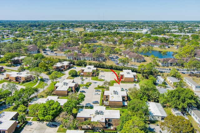 aerial view with a residential view and a water view