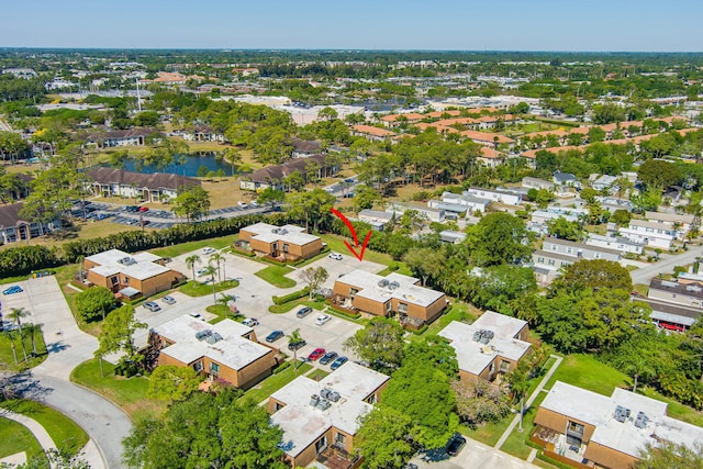 birds eye view of property with a residential view and a water view