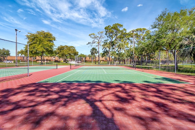 view of sport court with fence