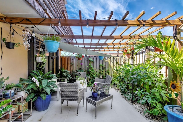 view of patio / terrace with fence and a pergola