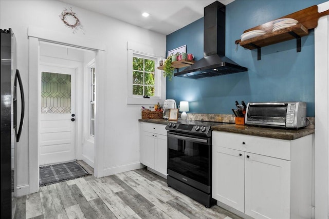 kitchen featuring electric stove, open shelves, dark countertops, range hood, and freestanding refrigerator