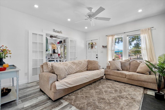 living room with recessed lighting, baseboards, wood finished floors, and a ceiling fan