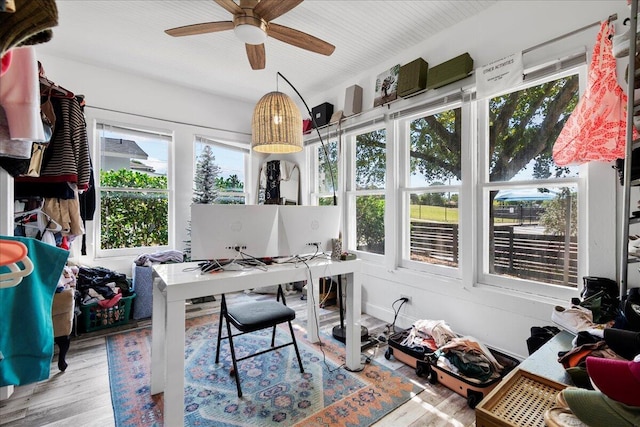 office area with a ceiling fan and wood finished floors