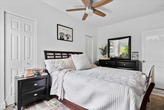 bedroom with a ceiling fan and wood finished floors