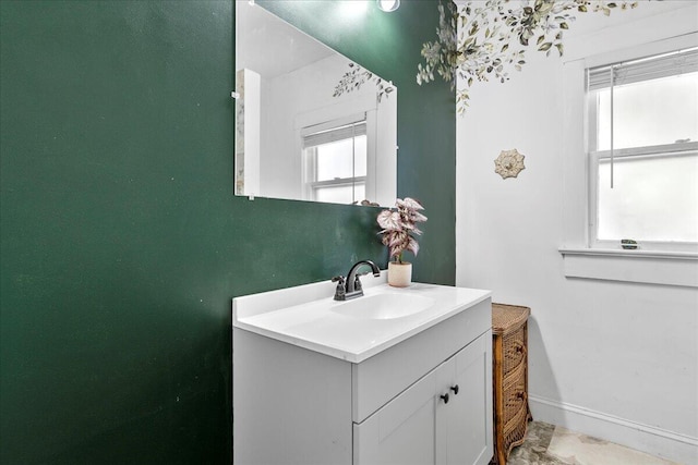 bathroom featuring vanity and baseboards