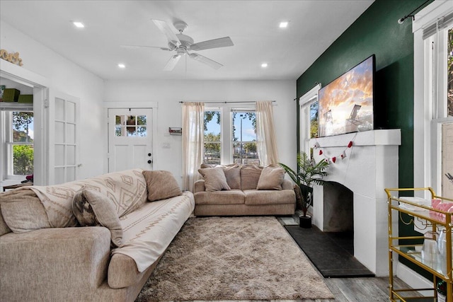 living room with recessed lighting, wood finished floors, and ceiling fan