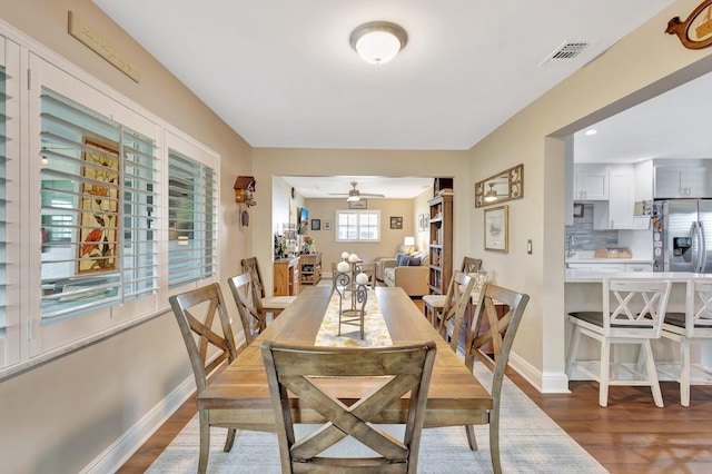 1504 SW 22nd Ave, Boynton Beach, FL 33426 - dining room featuring wood finished floors, baseboards, visible vents, and ceiling fan