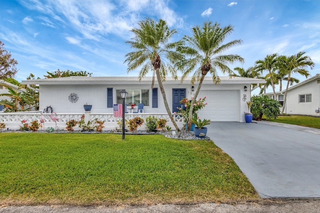 ranch-style house with an attached garage, concrete driveway, and a front lawn