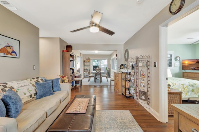 1504 SW 22nd Ave, Boynton Beach, FL 33426 - living room with visible vents, baseboards, dark wood-type flooring, and a ceiling fan
