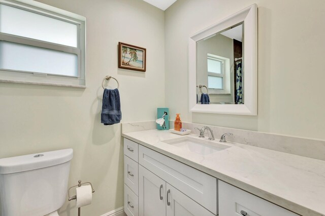 1504 SW 22nd Ave, Boynton Beach, FL 33426 - full bath with vanity, toilet, and plenty of natural light