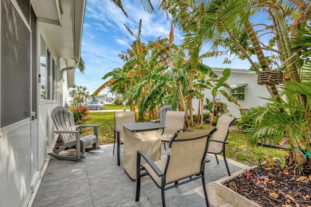 1504 SW 22nd Ave, Boynton Beach, FL 33426 - view of patio / terrace featuring outdoor dining area