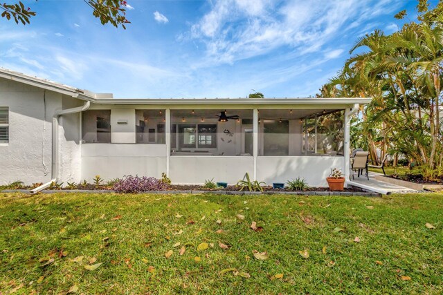 1504 SW 22nd Ave, Boynton Beach, FL 33426 - property entrance featuring a lawn, a patio, and stucco siding