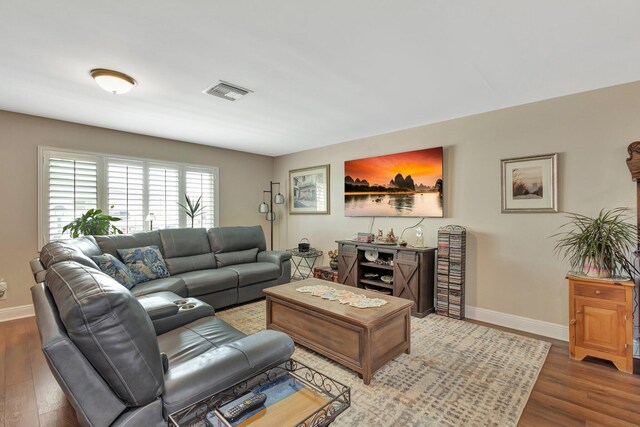 1504 SW 22nd Ave, Boynton Beach, FL 33426 - living area with visible vents, baseboards, and wood finished floors
