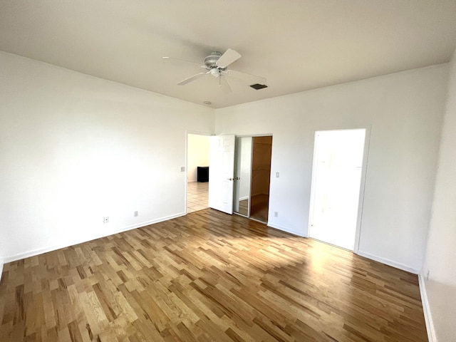 9675 Crescent View Dr N, Boynton Beach, FL 33437 - unfurnished bedroom with wood finished floors, baseboards, and a ceiling fan