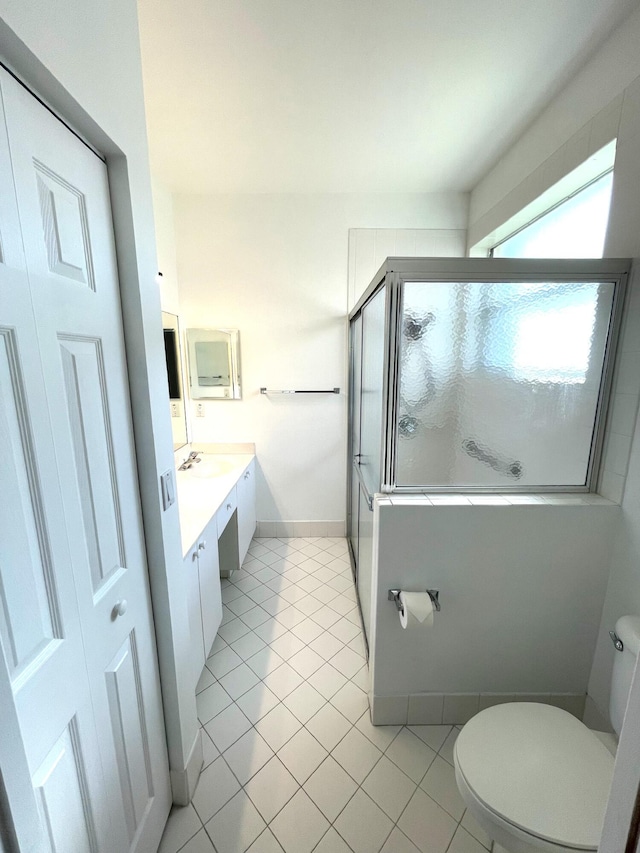 9675 Crescent View Dr N, Boynton Beach, FL 33437 - bathroom featuring toilet, an enclosed shower, tile patterned floors, vanity, and baseboards