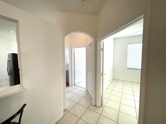 9675 Crescent View Dr N, Boynton Beach, FL 33437 - corridor featuring arched walkways and light tile patterned flooring