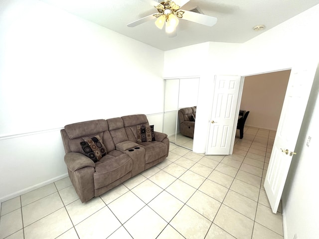9675 Crescent View Dr N, Boynton Beach, FL 33437 - living area featuring light tile patterned floors, a ceiling fan, and baseboards
