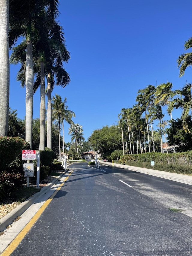 9675 Crescent View Dr N, Boynton Beach, FL 33437 - view of asphalt road featuring curbs