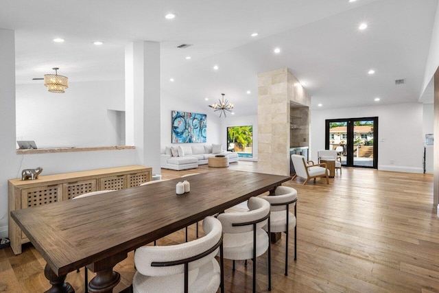 dining space featuring visible vents, high vaulted ceiling, recessed lighting, french doors, and light wood-type flooring