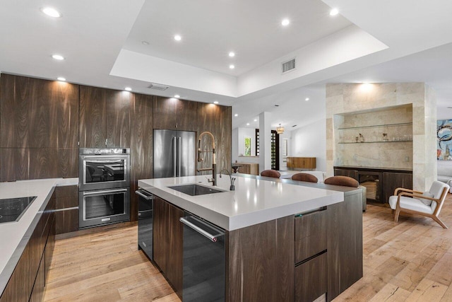 kitchen featuring a sink, stainless steel appliances, and modern cabinets