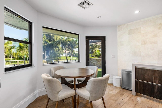 dining area with recessed lighting, visible vents, baseboards, and light wood finished floors