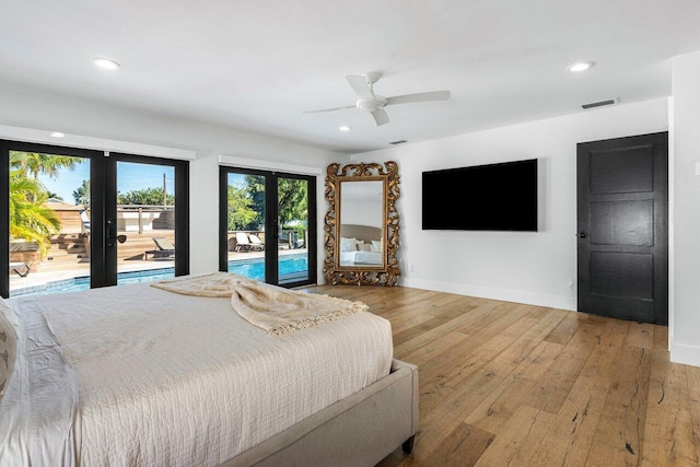 bedroom featuring visible vents, baseboards, access to exterior, french doors, and wood-type flooring