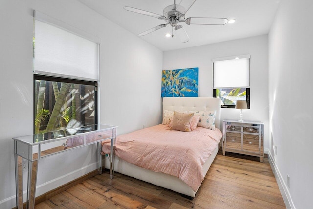 bedroom with recessed lighting, baseboards, wood finished floors, and a ceiling fan