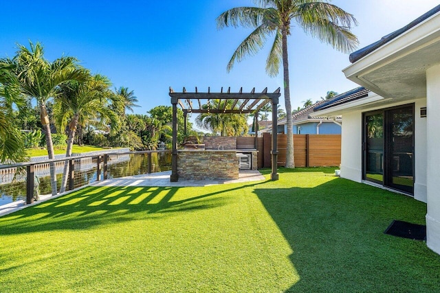 view of yard with a patio area, fence, and a pergola