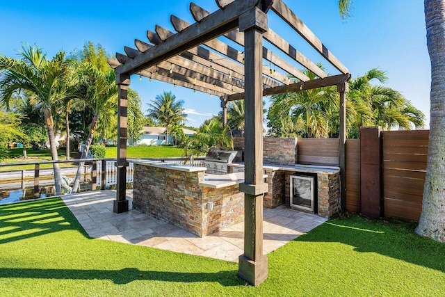 view of patio featuring area for grilling, a pergola, grilling area, and fence