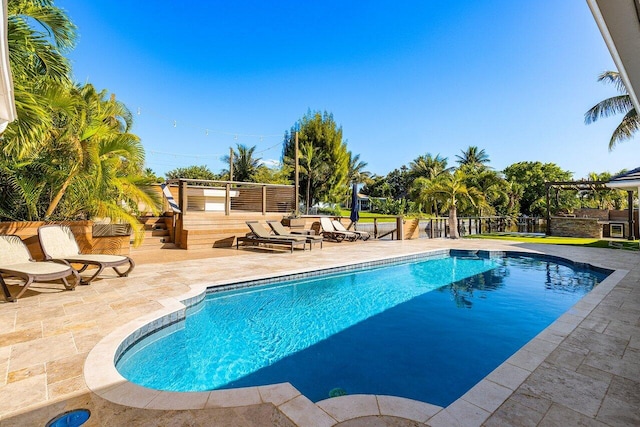 pool featuring a patio area and fence