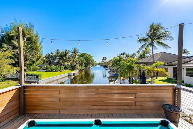 view of swimming pool featuring a water view