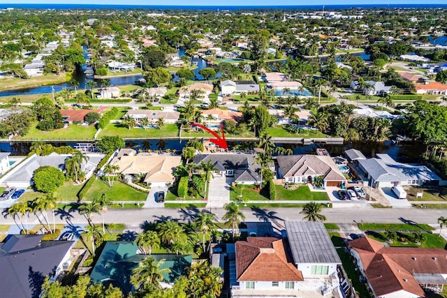 birds eye view of property with a residential view and a water view