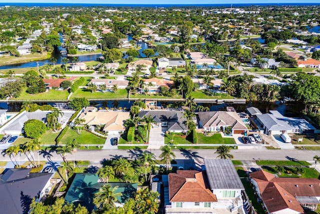 drone / aerial view with a residential view and a water view