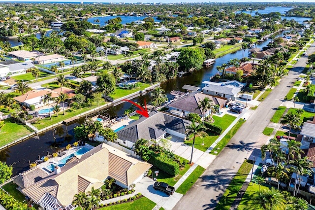 aerial view with a residential view and a water view