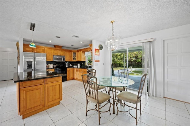 dining room with recessed lighting, a textured ceiling, an inviting chandelier, and light tile patterned flooring