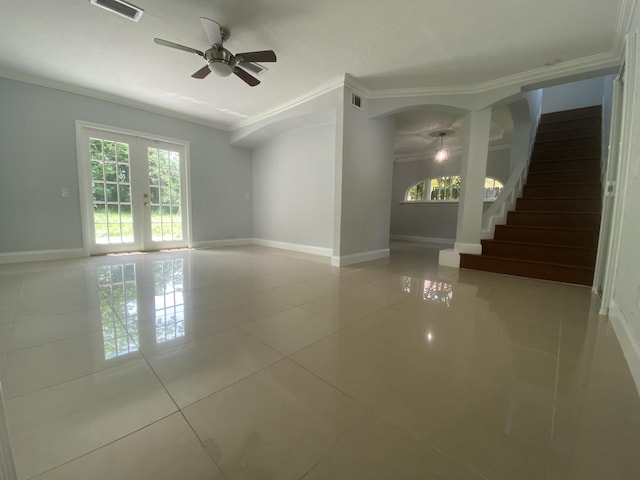 unfurnished room with french doors, crown molding, tile patterned flooring, baseboards, and stairs