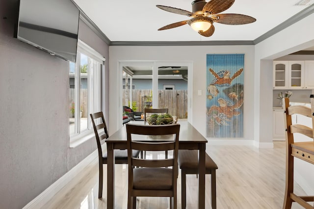 1351 SE 7th Ave, Pompano Beach, FL 33060 - dining space with a ceiling fan, crown molding, light wood finished floors, and baseboards