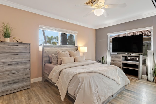 1351 SE 7th Ave, Pompano Beach, FL 33060 - bedroom with light wood-type flooring, ornamental molding, baseboards, and a ceiling fan