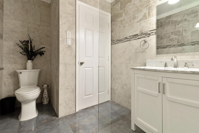 1351 SE 7th Ave, Pompano Beach, FL 33060 - bathroom featuring tile walls, vanity, and toilet