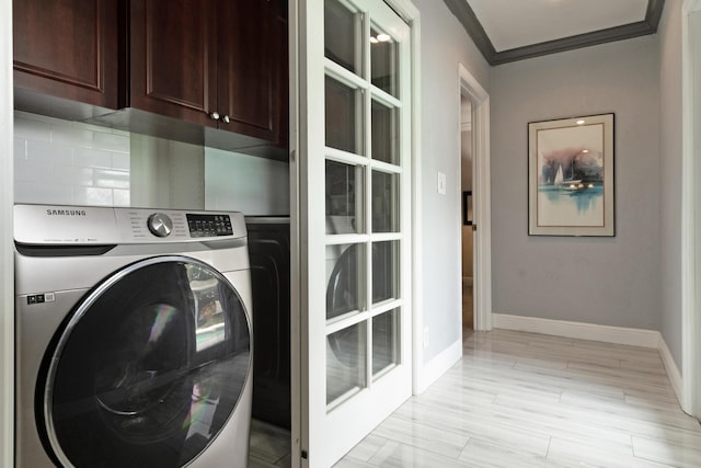 1351 SE 7th Ave, Pompano Beach, FL 33060 - clothes washing area with washer / dryer, cabinet space, baseboards, and ornamental molding