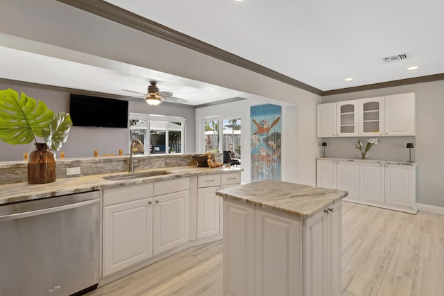 1351 SE 7th Ave, Pompano Beach, FL 33060 - kitchen featuring dishwasher, a sink, crown molding, light wood-type flooring, and light stone countertops