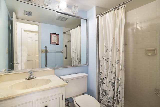 bathroom featuring a tile shower, visible vents, and toilet