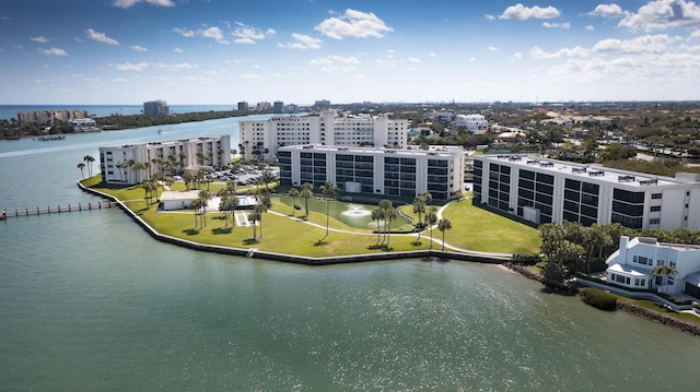 bird's eye view featuring a water view and a view of city