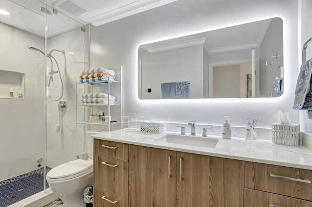 full bathroom featuring vanity, toilet, a shower stall, and crown molding