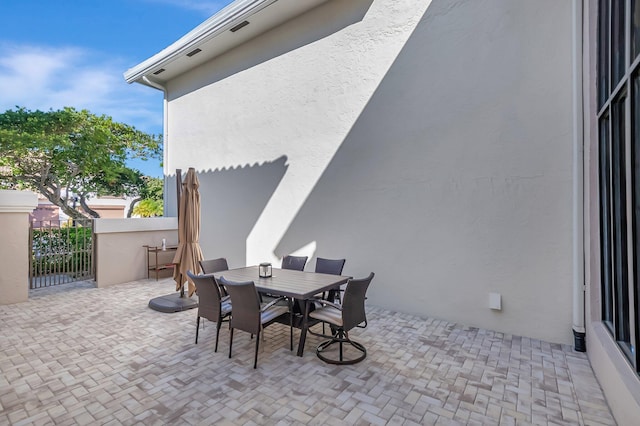 view of patio featuring outdoor dining area